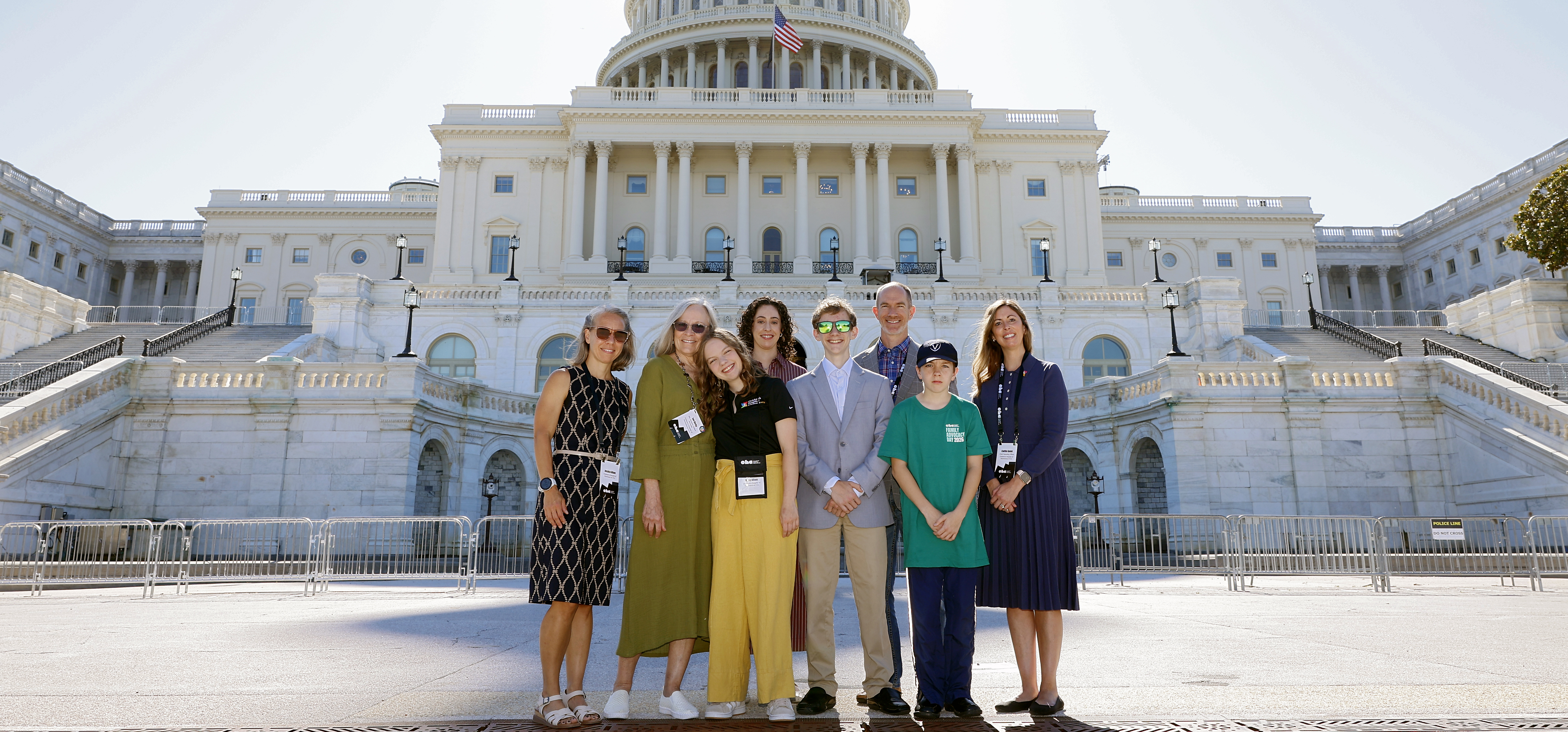 CHoR patient Riley stands with her family and CHoR team in front of the Capitol Building