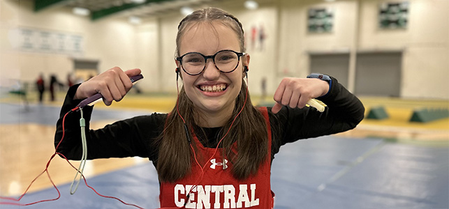 CHoR patient Allie Jones flexing in her track uniform