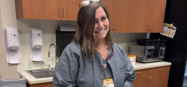 Bobbie Terrell, NICU nurse practitioner at CHoR smiling in scrubs