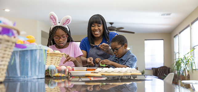 Family decorating Easter eggs