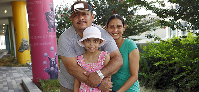 CHoR patient Estrella with her parents on the Children's Pavilion Sky Terrace