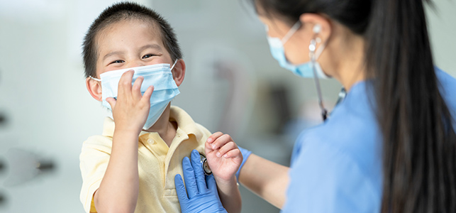 CHoR nurse checks smiling boy's heart with stethoscope