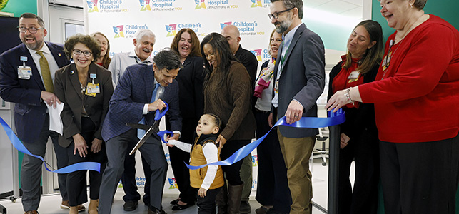 CHoR and VCU leaders along with a CHoR NICU graduate cut the ribbon on the new NICU