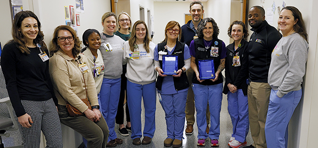 CHoR PICU nursing team holding awards for 2 years CLABSI free