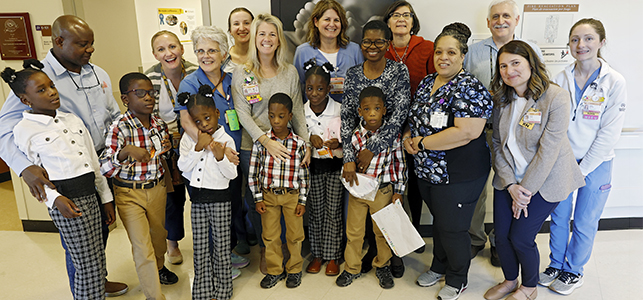 The Taiwo family with the CHoR NICU team