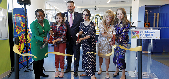 CHoR leaders and patient cut the ribbon on the Child Life Zone