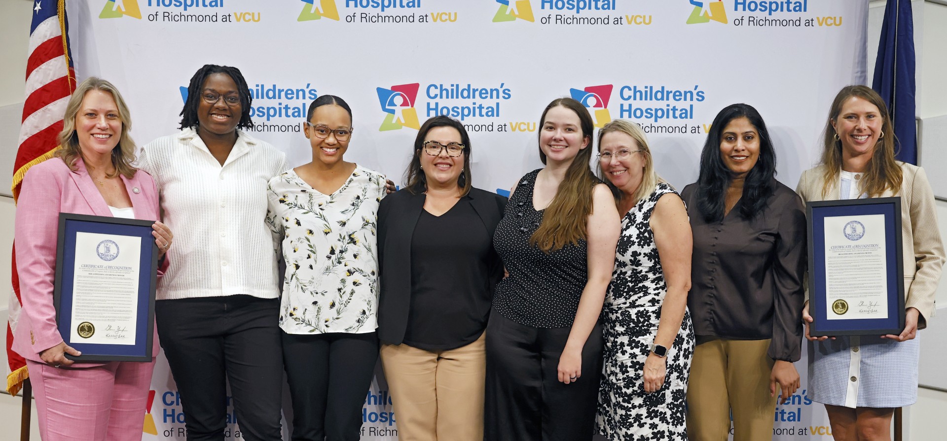 Donors pose alongside the Governor's proclamation during Virginia's National Breastfeeding Month event